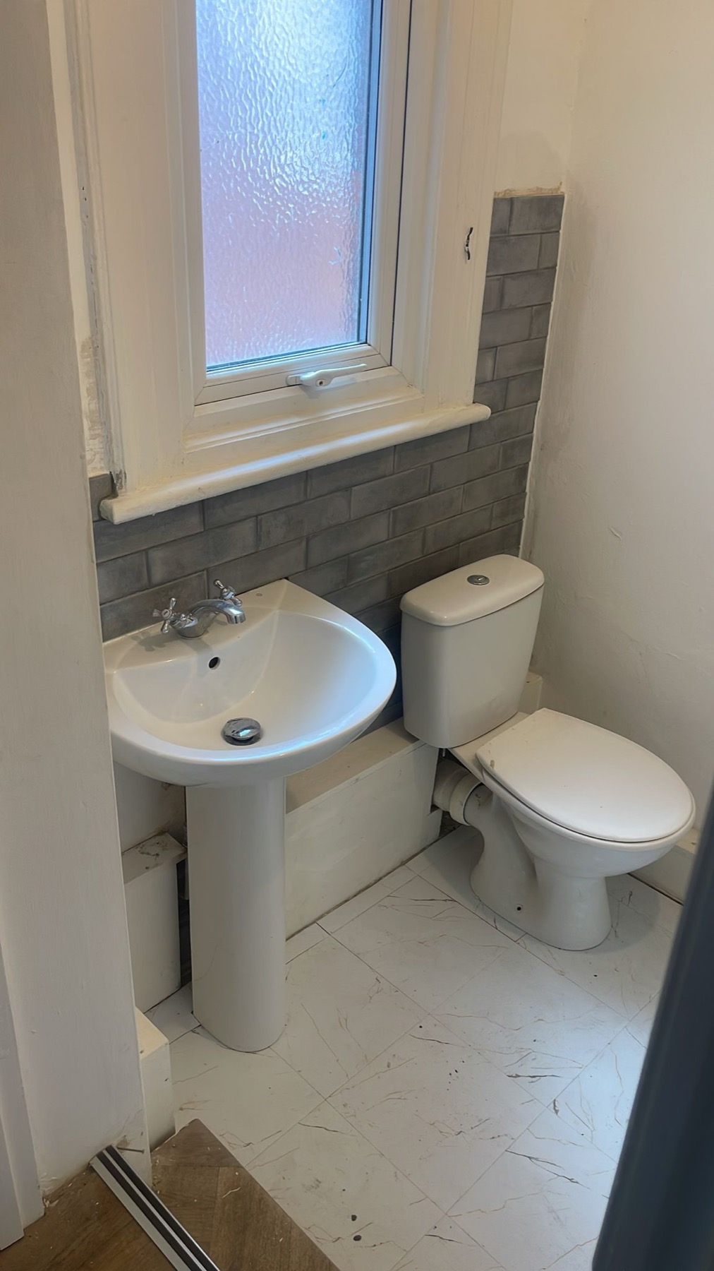 Bathroom with basin and toilet